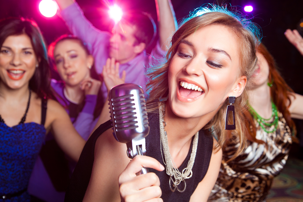 Create A Karaoke Party Powerhouse at Home with Your Stereo System singer